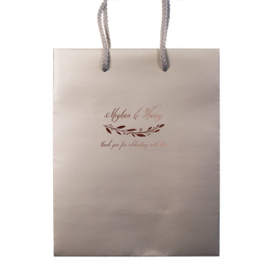 Present your gifts with the Royal Couple Wedding Bag, where sophistication meets celebration. The couple's names are etched in elegant script, grounded by a regal flourish, with space for a heartfelt message that exudes luxury from every angle.