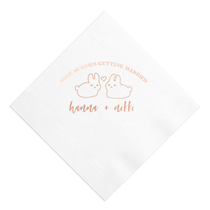 Hop into matrimonial joy with the Some Bunnies Wedding Napkin, complete with an adorable drawing of two bunnies and a heart nestled between them. The playful phrase "Some Bunnies Getting Married" sets a whimsical tone, while the area below awaits the couple's names, scripted with modern elegance. A delightful addition to your wedding tablescapes.