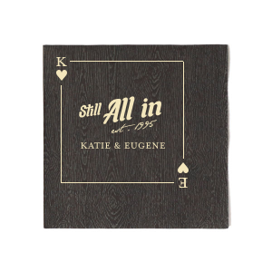Deal a hand of love with the Hearts Playing Card Still All In Anniversary Napkin, featuring a beautifully framed hearts playing card customizable with your initials. The bold statement "Still All In" is highlighted in the center, with the year of union in a delicate script below, and space to add the couple's names. A classic and heartfelt addition to your anniversary celebration.