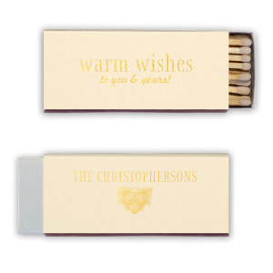 Ignite a hearthside glow with the Warm Wishes Matchbox, extending a toasty greeting to all. The family name and pinecone cluster on the reverse side kindle the essence of homely cheer, perfect for fireside gatherings and festive nights.