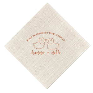Hop into matrimonial joy with the Some Bunnies Wedding Napkin, complete with an adorable drawing of two bunnies and a heart nestled between them. The playful phrase "Some Bunnies Getting Married" sets a whimsical tone, while the area below awaits the couple's names, scripted with modern elegance. A delightful addition to your wedding tablescapes.