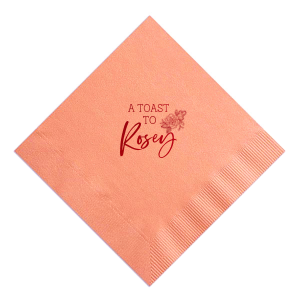 Celebrate in style with the Floral Toast Napkin. Adorned with “A TOAST TO” in bold block letters, it’s elegantly framed by an intricate peony design, symbolizing love and joy. Personalize with the celebrant’s name in beautiful script, making this napkin a meaningful addition to any special occasion.