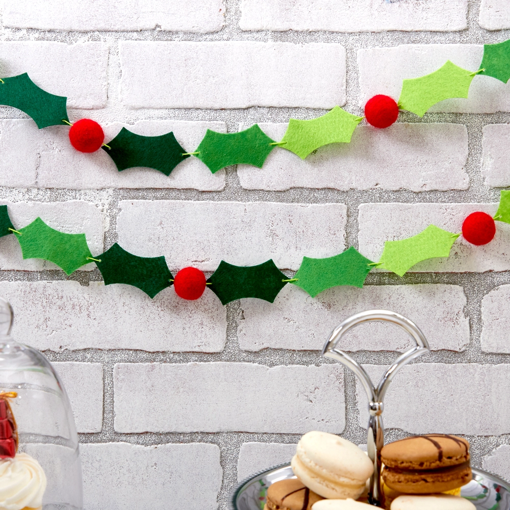 Add a felt banner of holly and berries to your décor this Christmas