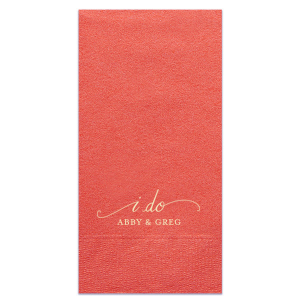 The I Do Flourish Name Napkin design artistically transforms the iconic wedding vow into a visual centerpiece. Flourished script forms an umbrella-like frame around "I Do," highlighting the couple's names, which are in a contrasting all-caps block font. This napkin combines elegance with artistic expression in a memorable keepsake.