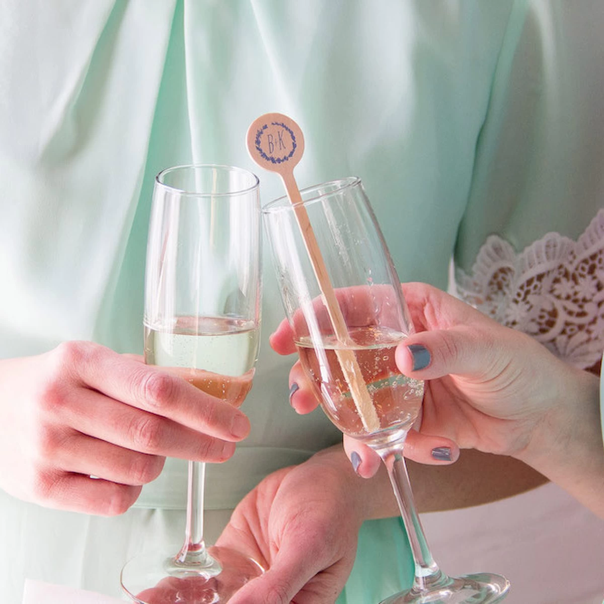 wedding champagne toast with custom cocktail stirrers