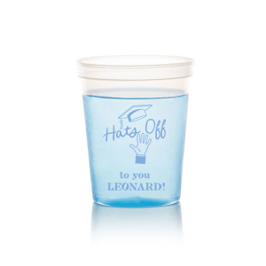 Celebrate the graduate's achievement with the Cap Toss Cheers Grad Cup, adorned with a hand throwing a graduation cap and the encouraging phrase "Hats off to you," alongside the name of the graduate. A personalized tribute to their hard work and bright future.