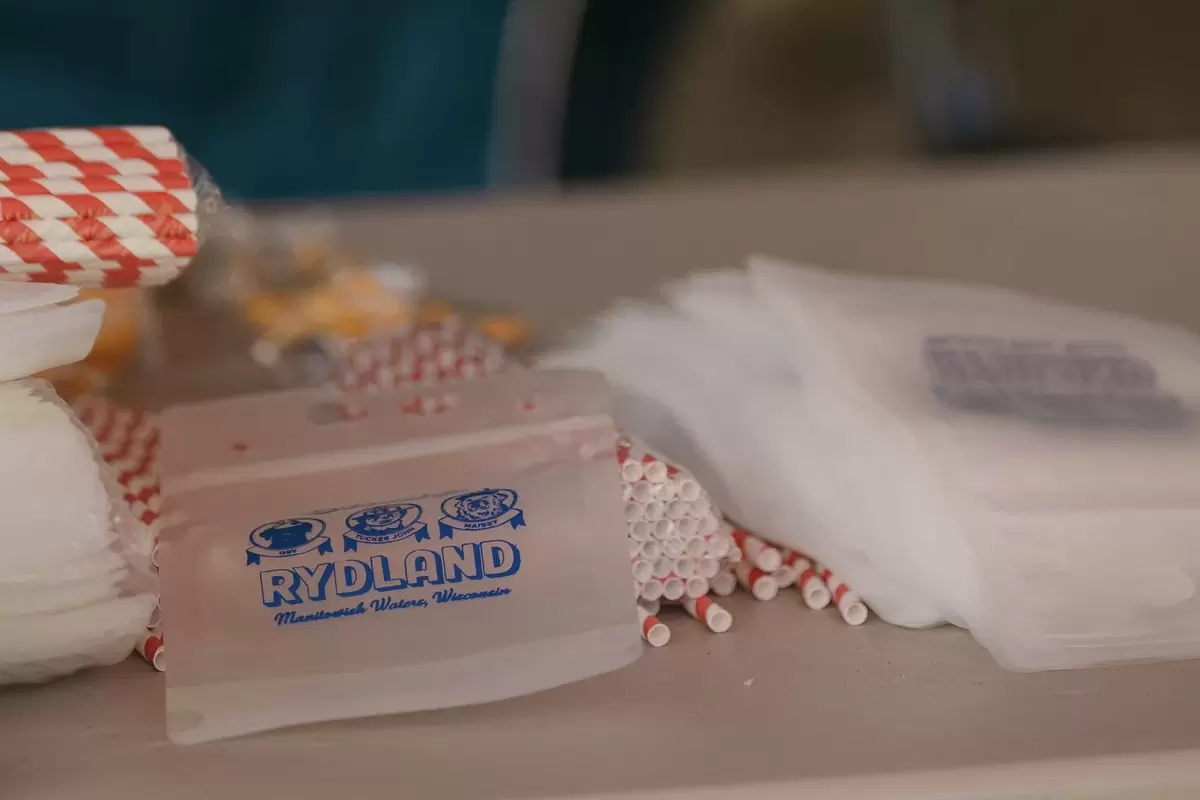 Empty custom drink pouches stacked on a table ready to use at a wedding 