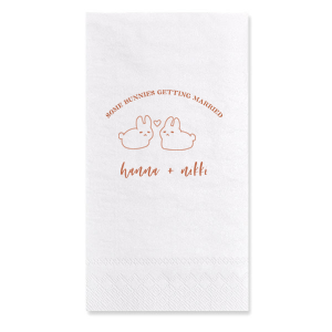 Hop into matrimonial joy with the Some Bunnies Wedding Napkin, complete with an adorable drawing of two bunnies and a heart nestled between them. The playful phrase "Some Bunnies Getting Married" sets a whimsical tone, while the area below awaits the couple's names, scripted with modern elegance. A delightful addition to your wedding tablescapes.