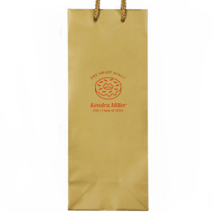 Pack up the celebration with the Clever Donut Grad Bag, tailored with the graduate’s name, school, and graduation year, complemented by a charming donut graphic and the witty phrase “One Smart Donut.” A perfect blend of humor and accolade for their scholastic achievements.