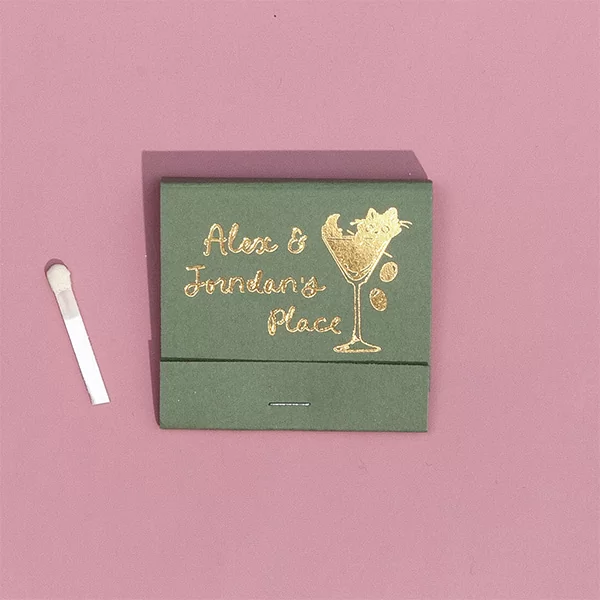 Green and Gold cat matches on a pink background