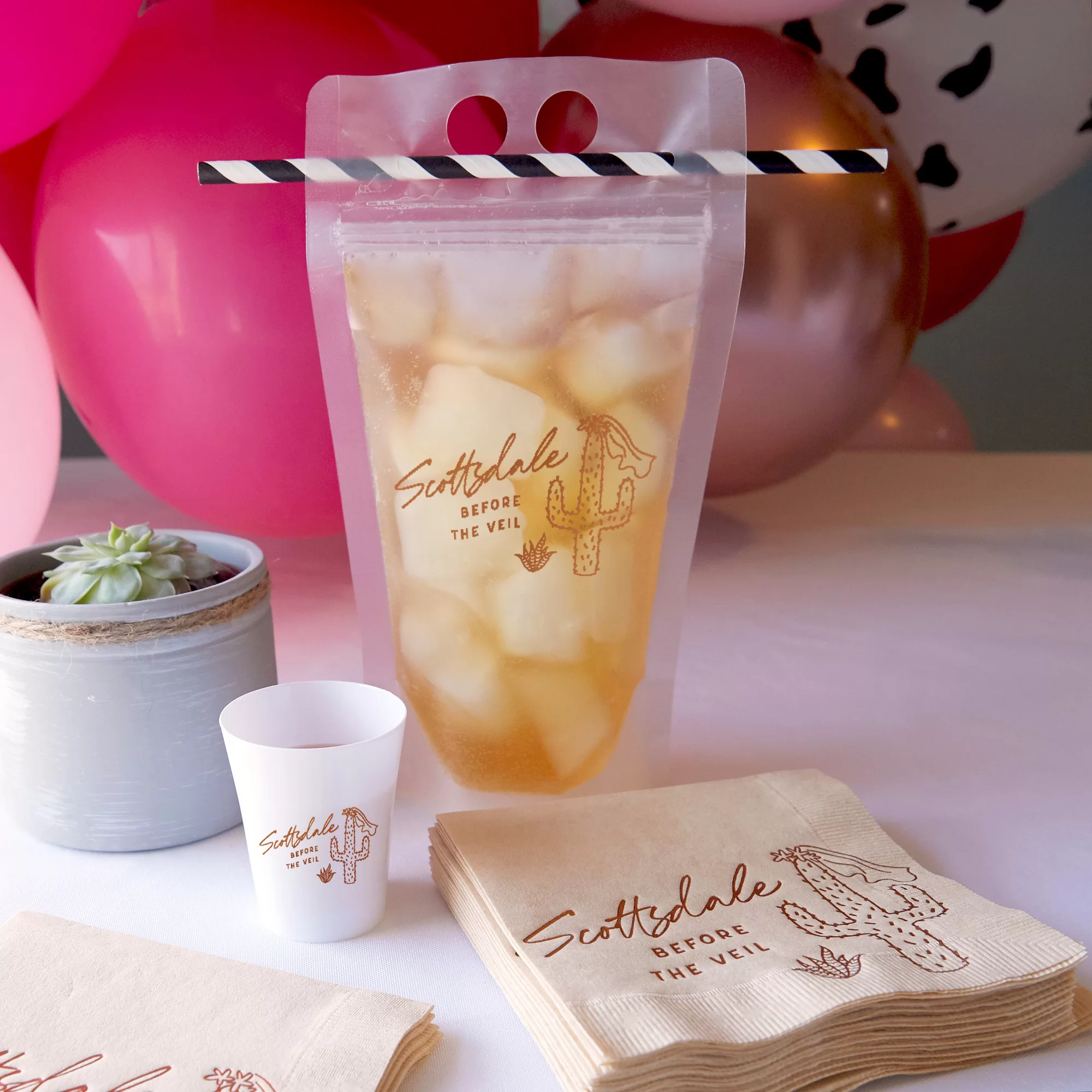 Party scene with Scottsdale napkins, pouches and shot glasses