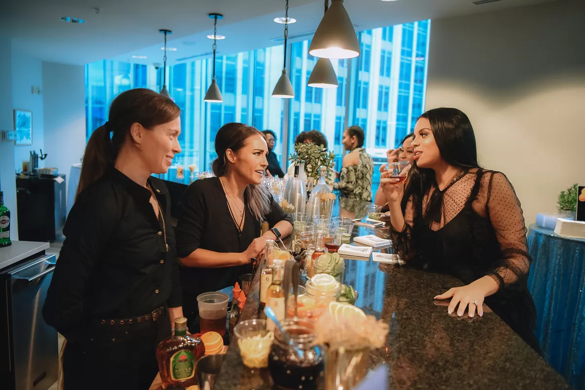 candid photo of guests at elegant shimmer and ombre gender reveal party