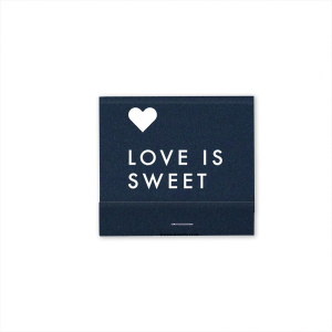 Celebrate the essence of love with the Love is Sweet Matchbox. Boldly declaring "Love is Sweet" with a floating heart above, this design captures the pure and heartfelt nature of love. A beautiful reminder that love, in all its complexity, is always sweet.