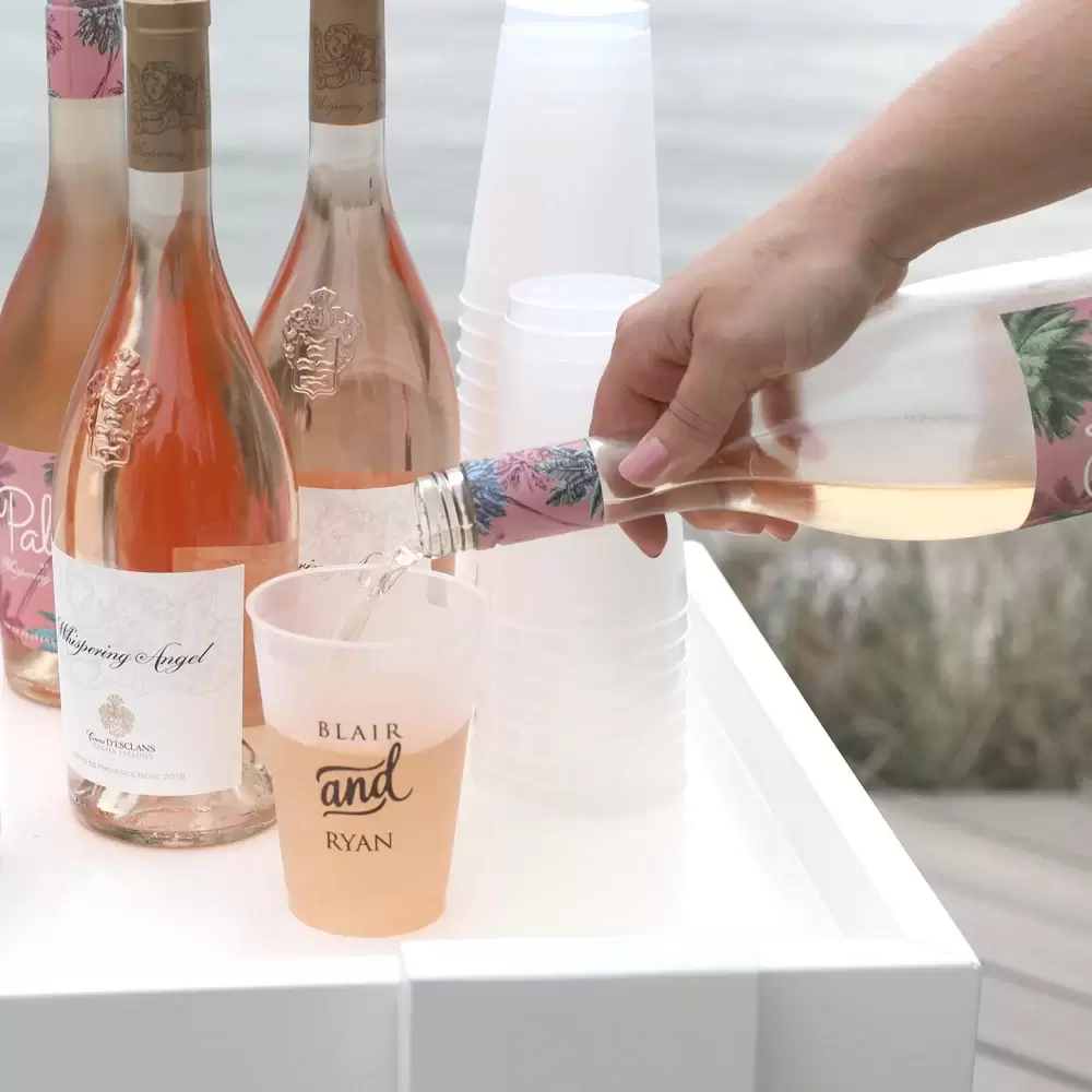 pouring blush wine into a custom bar cart frost flex cup
