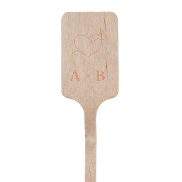 The Love-Strick Sitr Stick captures the essence of romance with a minimal heart pierced by an arrow, symbolizing the timeless connection between you and your partner. Below this tender graphic, personalize the stir stick with both of your initials, presented in a clean, modern style that complements the simplicity of the design. This elegant and understated accessory is perfect for adding a personal touch to any love-filled occasion.