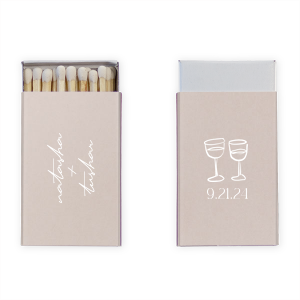 Light up your autumnal love story with the Boho Terracotta Line Art Wedding Matchbox. Customize one side with the couple's names elegantly scripted, symbolizing unity. The other side is adorned with a minimalist line drawing of two clinking wine glasses, topped by the wedding date in a refined serif font, ready to commemorate your chic, moody celebration.