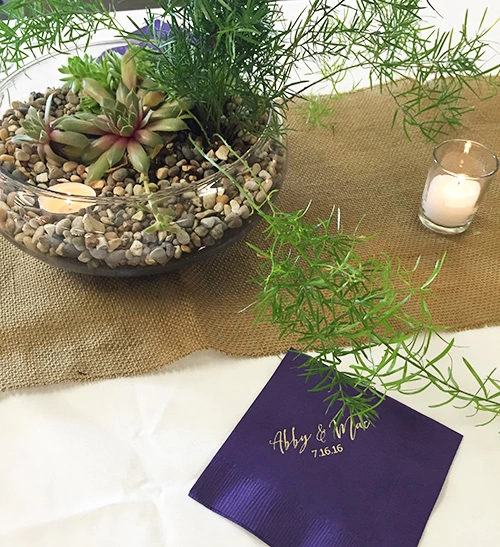 Succulent centerpieces with personalized cocktail napkin