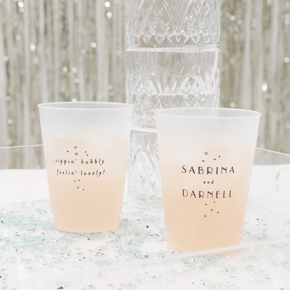 Personalized frosted plastic cups add style to your wedding bar.