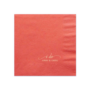 The I Do Flourish Name Napkin design artistically transforms the iconic wedding vow into a visual centerpiece. Flourished script forms an umbrella-like frame around "I Do," highlighting the couple's names, which are in a contrasting all-caps block font. This napkin combines elegance with artistic expression in a memorable keepsake.