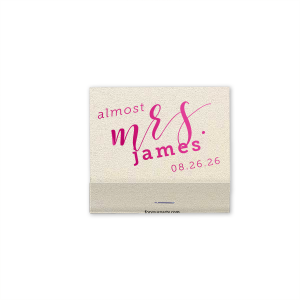 The Excitement Ignites! Celebrate the bride-to-be with the Almost Mrs. Matchbox. Featuring a dramatic "almost Mrs." script on the front and "Love" surrounded by floating hearts on the back, this vibrant design captures the rising excitement as the big day approaches. Perfect for wedding showers and bachelorette parties!