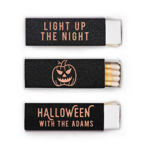 Illuminate your Halloween with the Light Up the Halloween Night Matchbox. One side showcases an eerie pumpkin graphic and the words "Light up the Night," sparking festive thrills. The reverse says "Halloween," with room for personalization—perfect for setting the mood at your spooky gathering! 