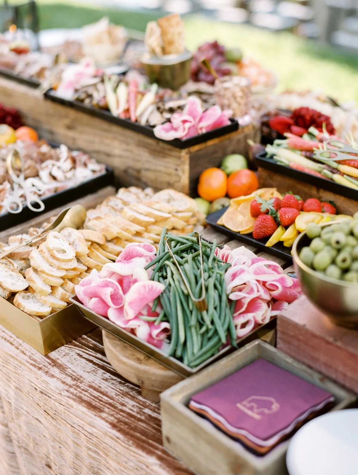 Their wedding logo amongst the grazing table on napkins!