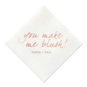 The Loving Blush Napkin exudes romantic charm. It features the phrase "you make me blush!" in a playful, lowercase script, capturing the essence of being touched by love and affection. Beneath, the couple’s names add a personal touch, beautifully embodying a moment of tender, loving emotion.
