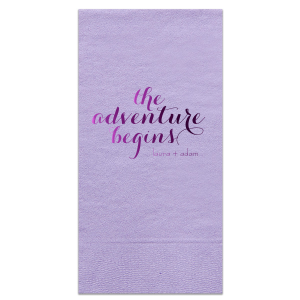 The Elegant Swirl Script Adventure Begins Napkin captures the essence of a new journey with "The Adventure Begins" in an energetic swirling script. This straightforward design, focusing on the excitement of the couple's upcoming life together, makes a striking statement.