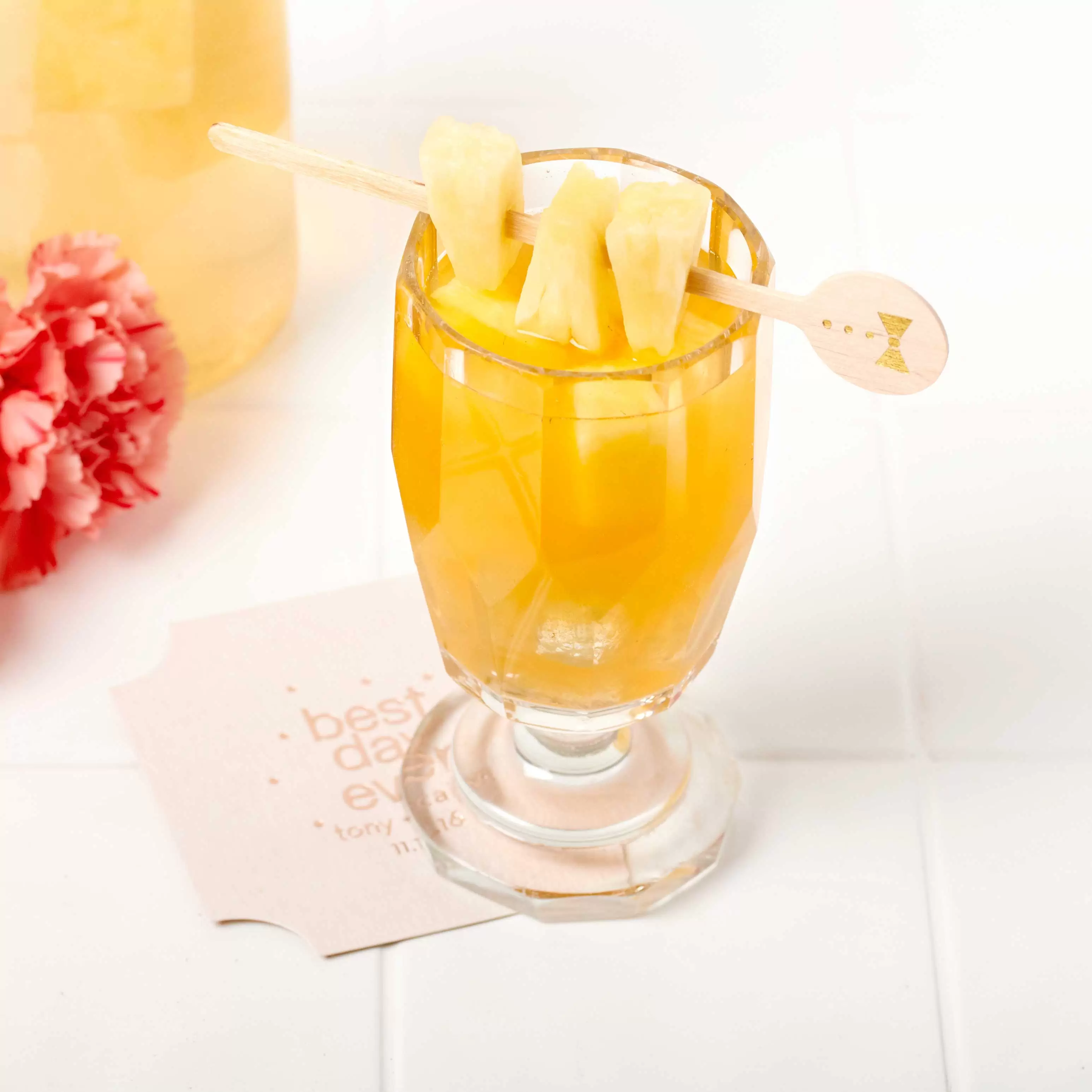 Pineapple Rum Punch cocktail with personalized drink stirrer