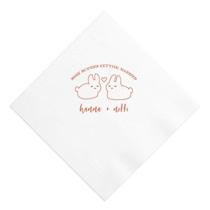 Hop into matrimonial joy with the Some Bunnies Wedding Napkin, complete with an adorable drawing of two bunnies and a heart nestled between them. The playful phrase "Some Bunnies Getting Married" sets a whimsical tone, while the area below awaits the couple's names, scripted with modern elegance. A delightful addition to your wedding tablescapes.