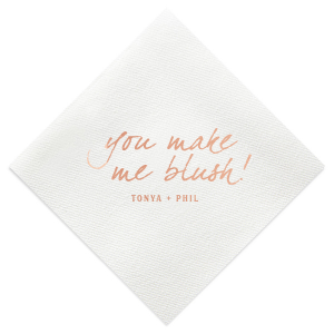 The Loving Blush Napkin exudes romantic charm. It features the phrase "you make me blush!" in a playful, lowercase script, capturing the essence of being touched by love and affection. Beneath, the couple’s names add a personal touch, beautifully embodying a moment of tender, loving emotion.
