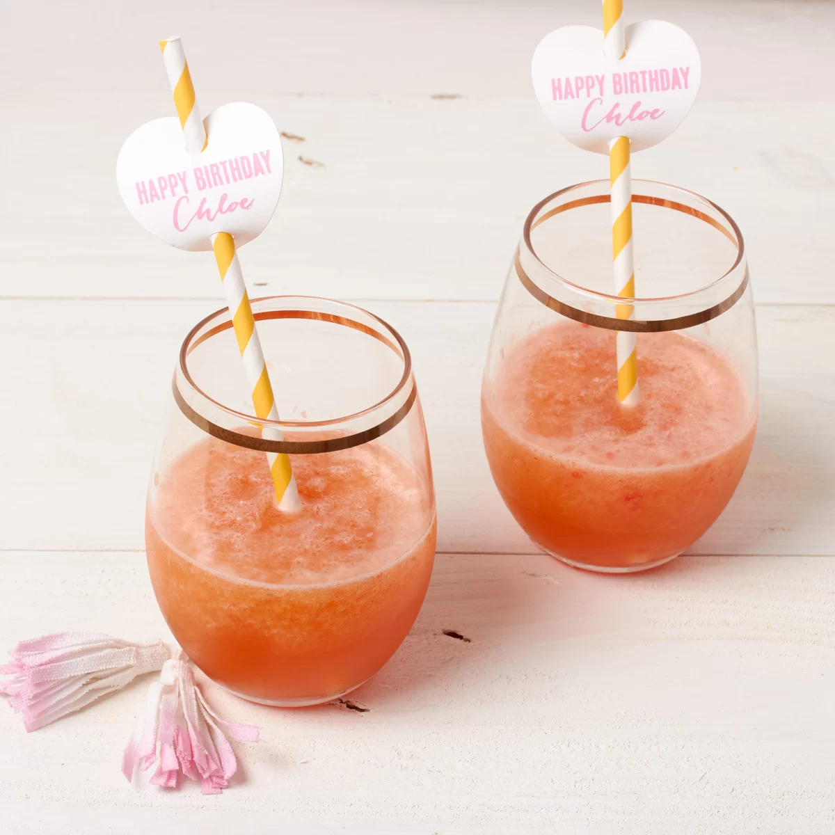 frost, frozen rose cocktail with personalized heart straw tags