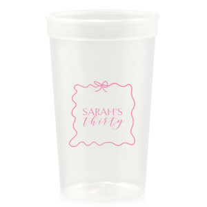 Sip in style at your birthday bash with the Ribbon Frame Birthday Bash Cup, elegantly framed like a ribbon and bow, featuring your name and new age in a whimsical script. A festive and personalized touch to celebrate another fabulous year.