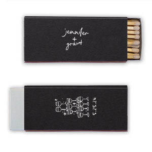  Light up the night with the Kitschy Cocktail Hour Toasting Glasses Matches, a whimsically modern addition to your wedding day. Each matchbox, personalized with the couple's names in a hand-drawn-inspired script, flips to reveal a contemporary line drawing of a wine glass pyramid and the date, perfect for commemorating your toast to forever.