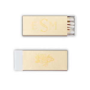 The Monogram Flower Matchbox design combines simplicity with elegance. On one side, a modern monogram in a refined font represents the couple. The other side features a single peony, symbolizing love, honor, and joy, amidst lush greenery. This matchbox is a subtle yet meaningful nod to lasting love and beauty.