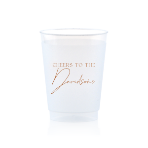 Raise a toast with the Boho Terracotta Cheers to the Wedding Cup, where rustic meets refinement. The phrase "Cheers to the" is beautifully presented in a classic serif font, inviting you to inscribe the couple's surname below in a sophisticated script. A cup that embodies the warmth and subtle drama of your autumnal nuptials.