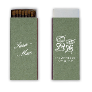 The Wedding Glass & Bow Matchbox is the stylish and trendy design for your next big party event. Featuring hand-drawn bows tied around champagne glasses alongside customizable text in the foil stamp and paper color of your choice to best pair with your party's vibe.