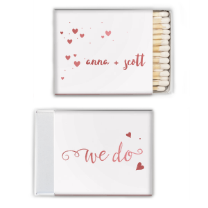 Proclaim your love with the We Do Name Heart Wedding Matchbox. Featuring the timeless words "We do" in elegant script and a heart symbol, this design beautifully signifies the couple's unity. A charming nod to the commitment that seals the deal!