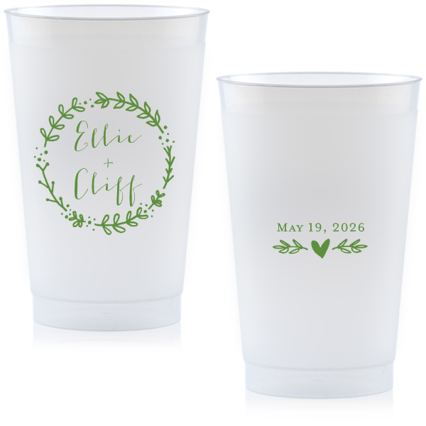 Raise a glass with the Wreath Names Cup where a playful leafy wreath lovingly encases your names. On the back, a branch with a centered heart underscores the date, infusing whimsy into every sip at your celebration.