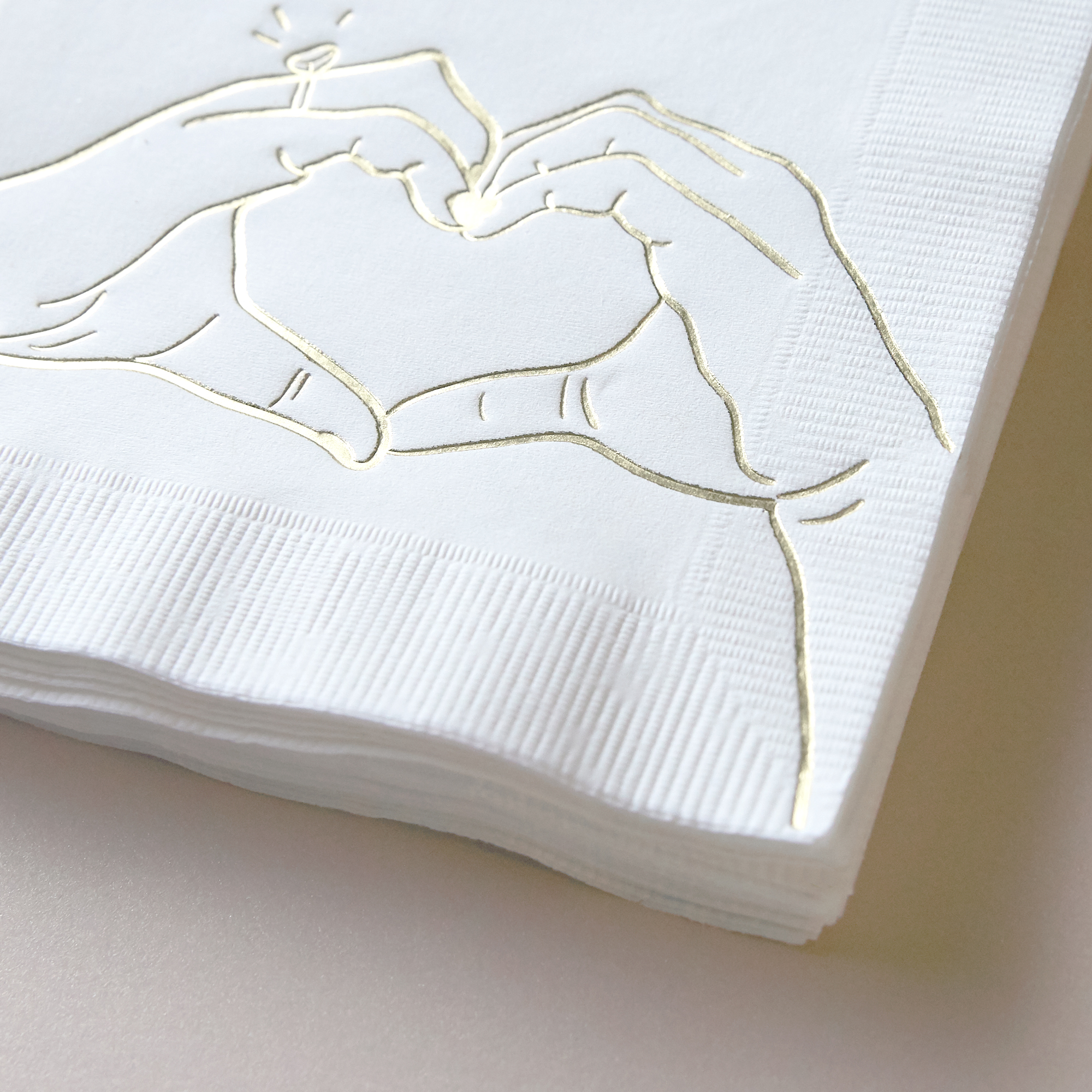 Closeup of Heart Hands Foil Party Napkins