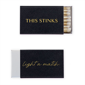Add a humorous touch to practicality with our This Stinks Match. With a bold statement on the front, it brings a light-hearted approach to an age-old courtesy. The back gently prompts "Light a Match" in elegant cursive. Ideal for events, these matches offer a witty solution for bathroom etiquette.