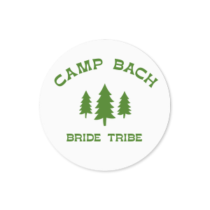 Label your bachelorette party essentials with the Camp Bachelorette Wilderness Label, featuring a serene forest scene topped with "Camp Bach" in an arch, evoking the spirit of adventure. An ideal accent for your camp themed bachelorette getaway.