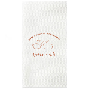 Hop into matrimonial joy with the Some Bunnies Wedding Napkin, complete with an adorable drawing of two bunnies and a heart nestled between them. The playful phrase "Some Bunnies Getting Married" sets a whimsical tone, while the area below awaits the couple's names, scripted with modern elegance. A delightful addition to your wedding tablescapes.