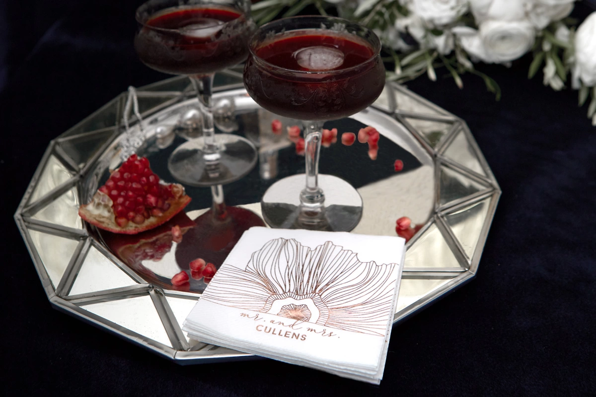bourbon pomegranate manhattan cocktail recipe with wedding napkins