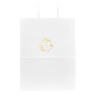 The Romantic Peony Frame Monogram Bag elegantly captures the essence of joy and romance. A wreath of lush peonies and greenery forms a delicate frame, encircling the celebrant's initial in a graceful display. This design exudes elegance, symbolizing happiness, prosperity, and a blissful union.