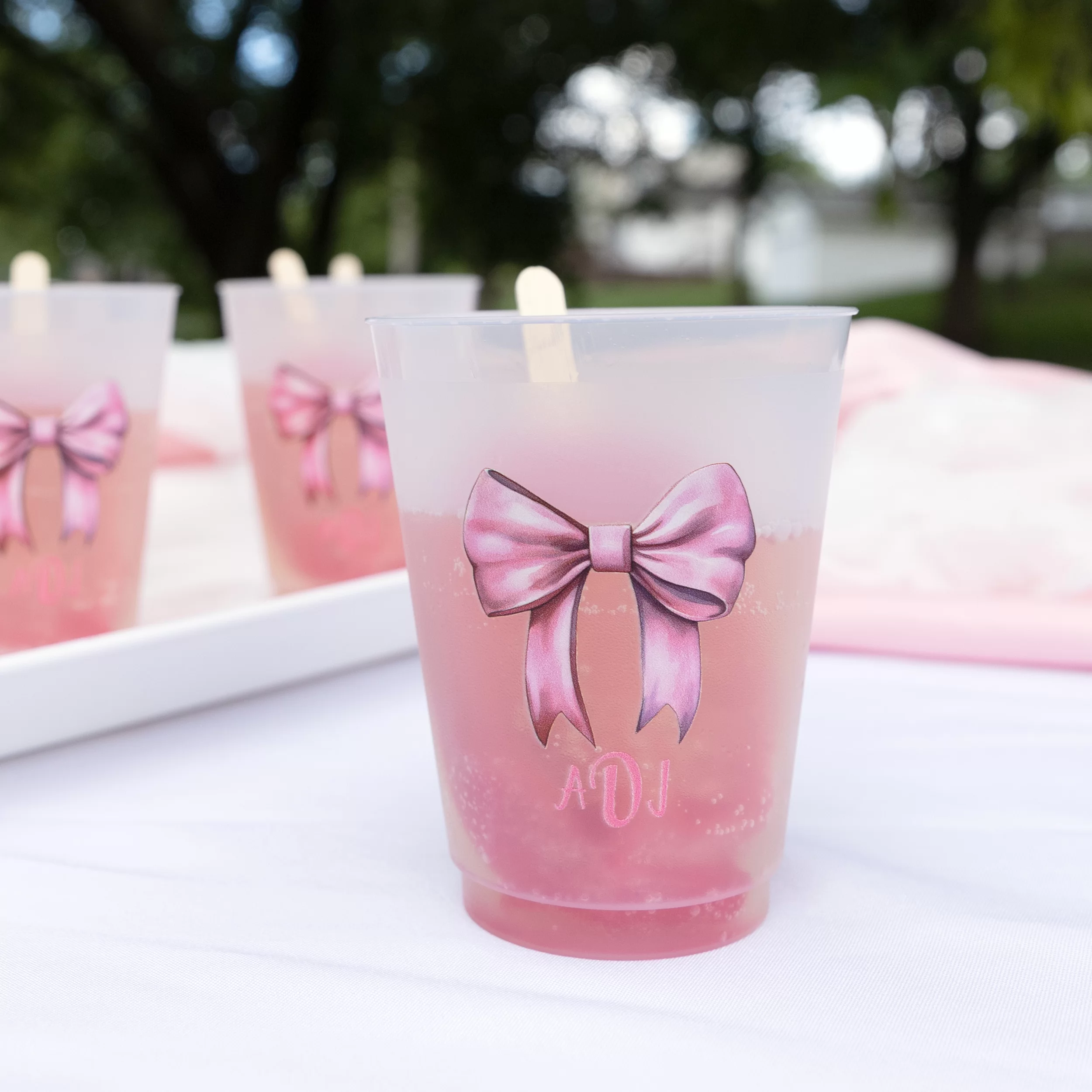 Frosted Plastic cup with pretty pink painted bow and initials