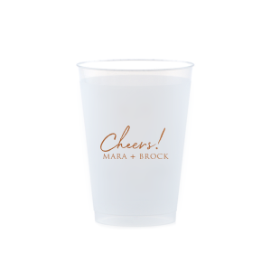 Raise a toast with the Cheers to the Couple Name Cup, where festivity meets elegance. A large, fanciful "Cheers!" in an exuberant script sets the stage for celebration, while the couple's names in bold capitals underscore the personal touch. This frosted cup's simple yet impactful design perfectly encapsulates the spirit of a joyous toast to love and unity.