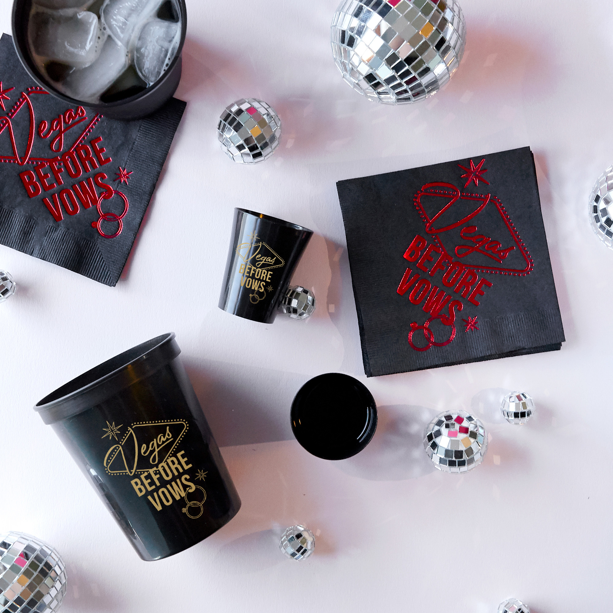 Party scene with black cups and shot glasses