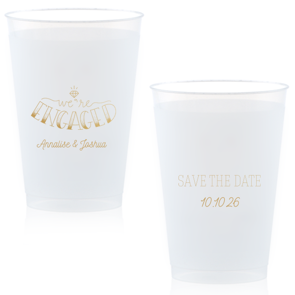 The Diamond Engagement Cup design dazzles with a sparkling diamond graphic and bold "ENGAGED" in 3D artistry. Scripted "we’re" and the couple's names add charm, while the other side cheerfully announces "Save the Date," infusing the cup with celebratory excitement and anticipation.