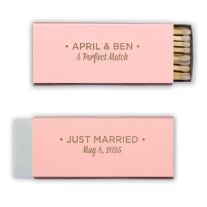 The Modern Perfect Match matchbox stylishly displays the couple’s names in bold block letters, framed by dots. Below, “A Perfect Match” in traditional script adds whimsy. The reverse side proclaims “JUST MARRIED,” with the wedding date, melding modern design with romantic charm.